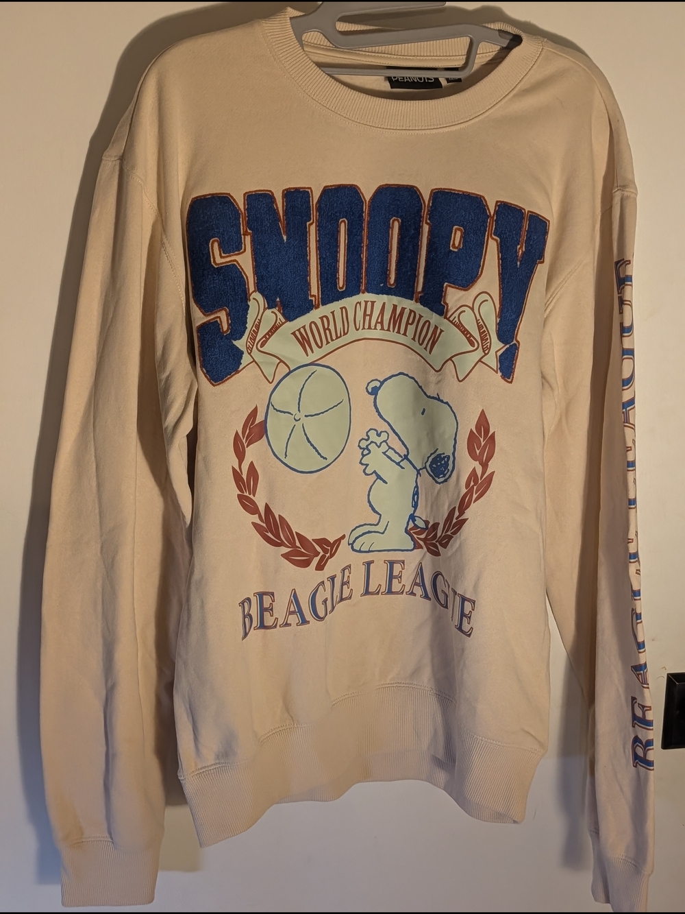 Peanuts Cream Snoopy Unisex Sweatshirt with Blue Chenille Appliqué and Rust Trim